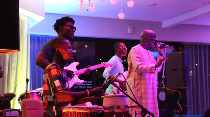 Senegalese legend Omar Pene (far right) and his band take the stage in Dakar.