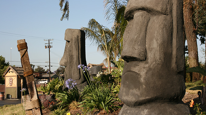 Rapa Nui statues reminiscent of those on Easter Island decorate the Mission Tiki Drive-In Theatre